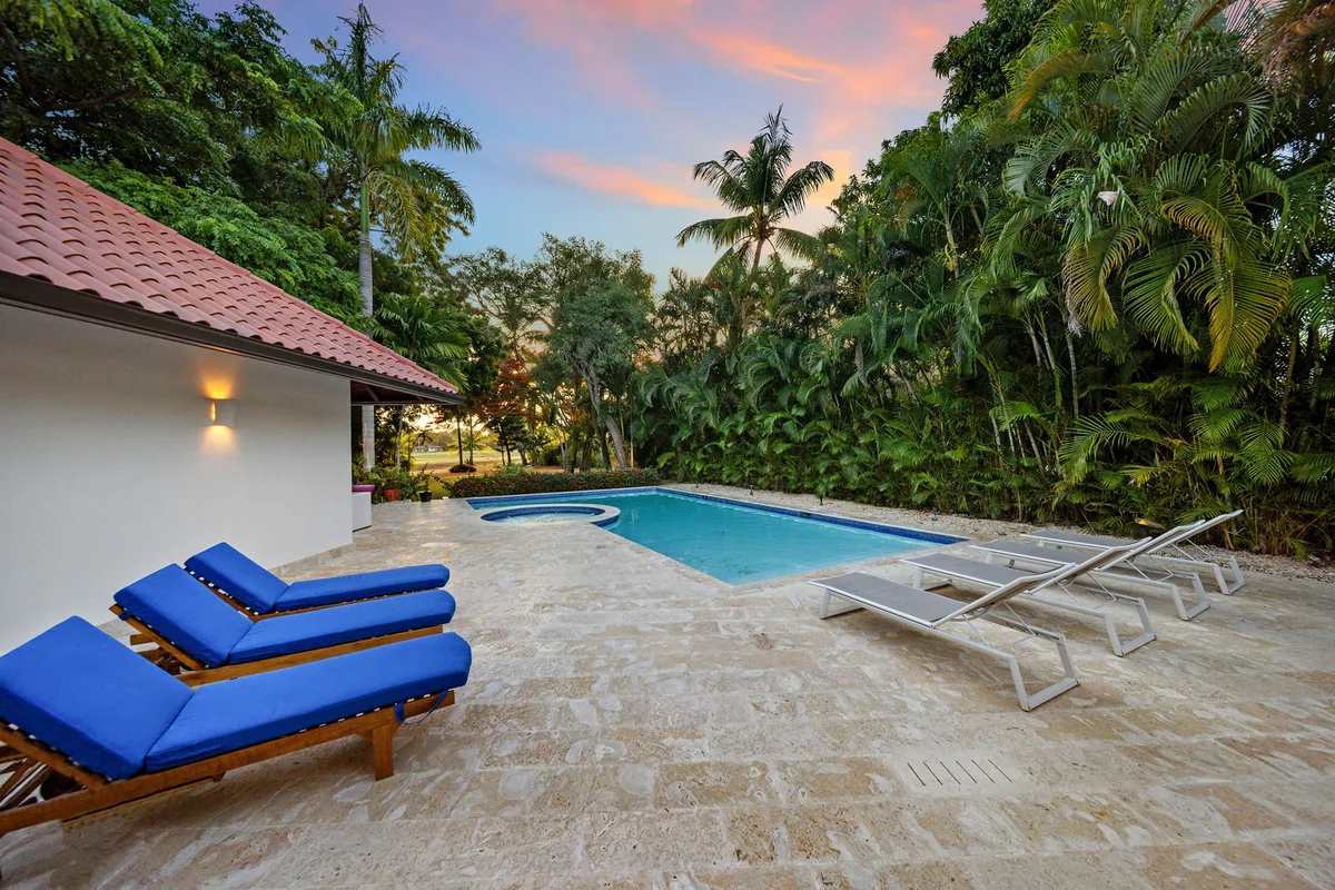 Private pool terrace enclosed by established tropical planting